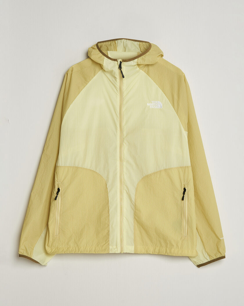The North Face NSE Wind Jacket Lemon Mist – Geel