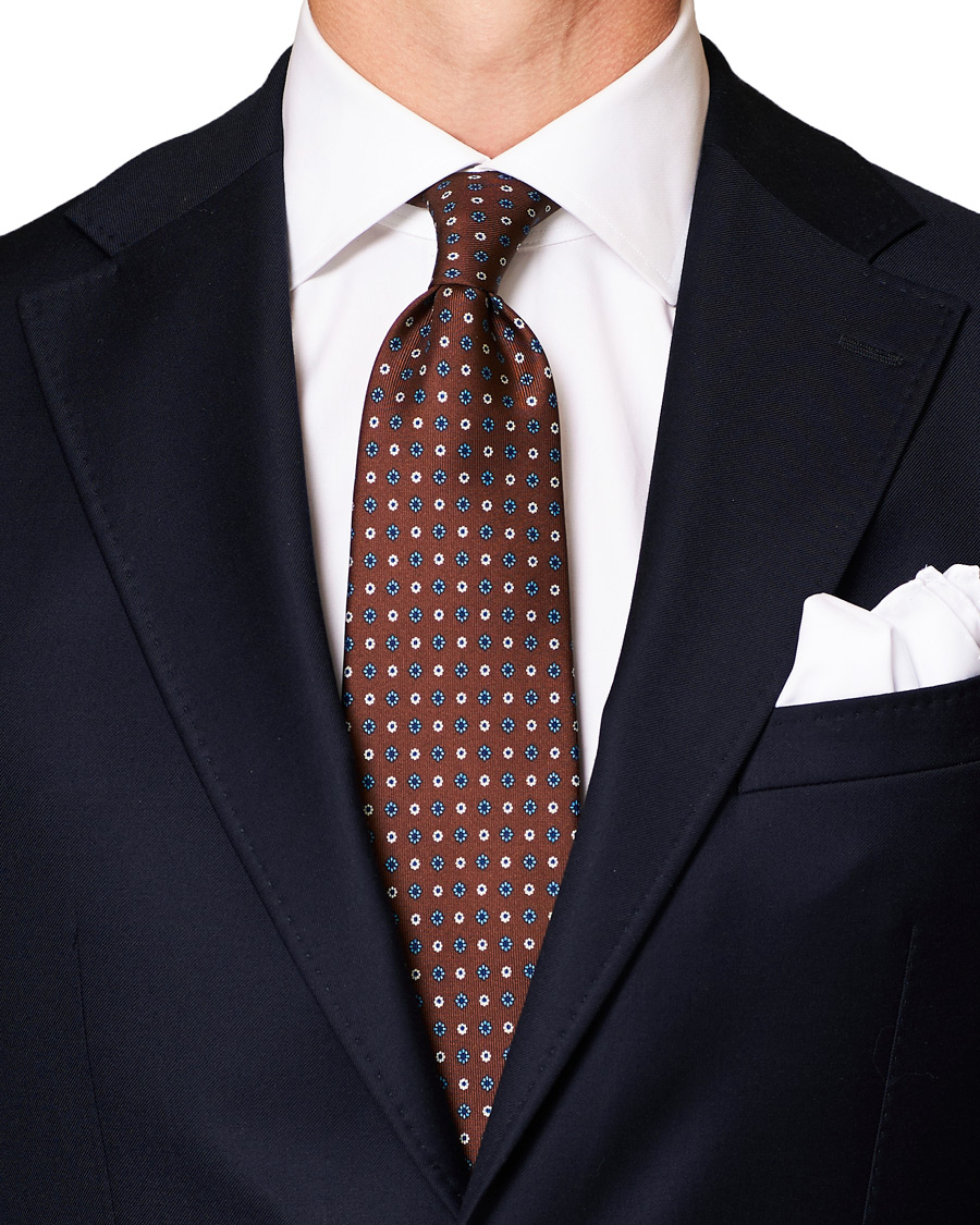 Homme | E. Marinella 3-Fold Printed Flower 8 cm Silk Tie Dark Brown | E. Marinella | 3-Fold Printed Flower 8 cm Silk Tie Dark Brown